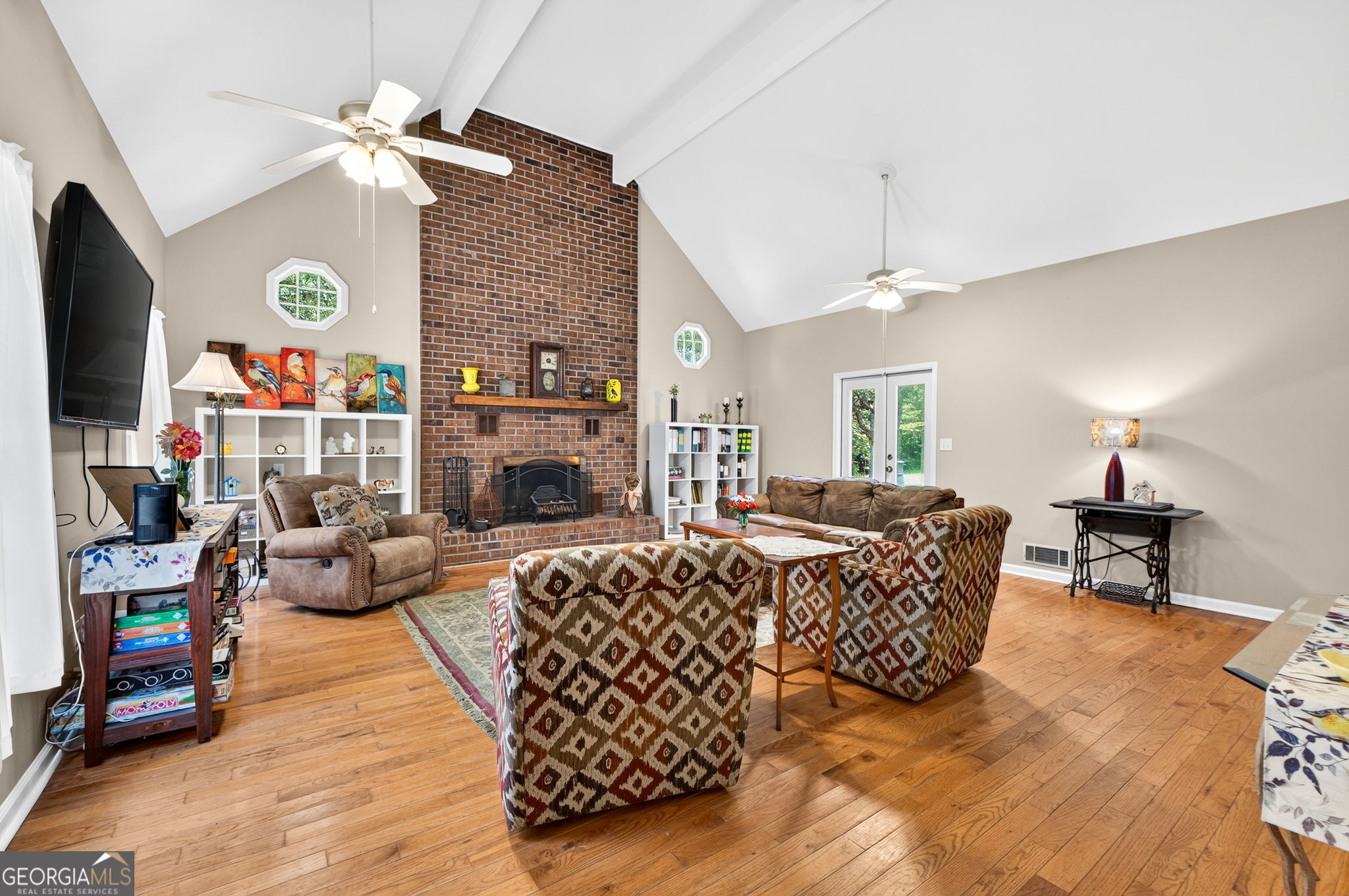 169 Silver Dollar Road Barnesville, GA 30204 - Photo 24 of 66 Large floor to ceiling brick fireplace, wood flooring, fresh Paint, access to back patio