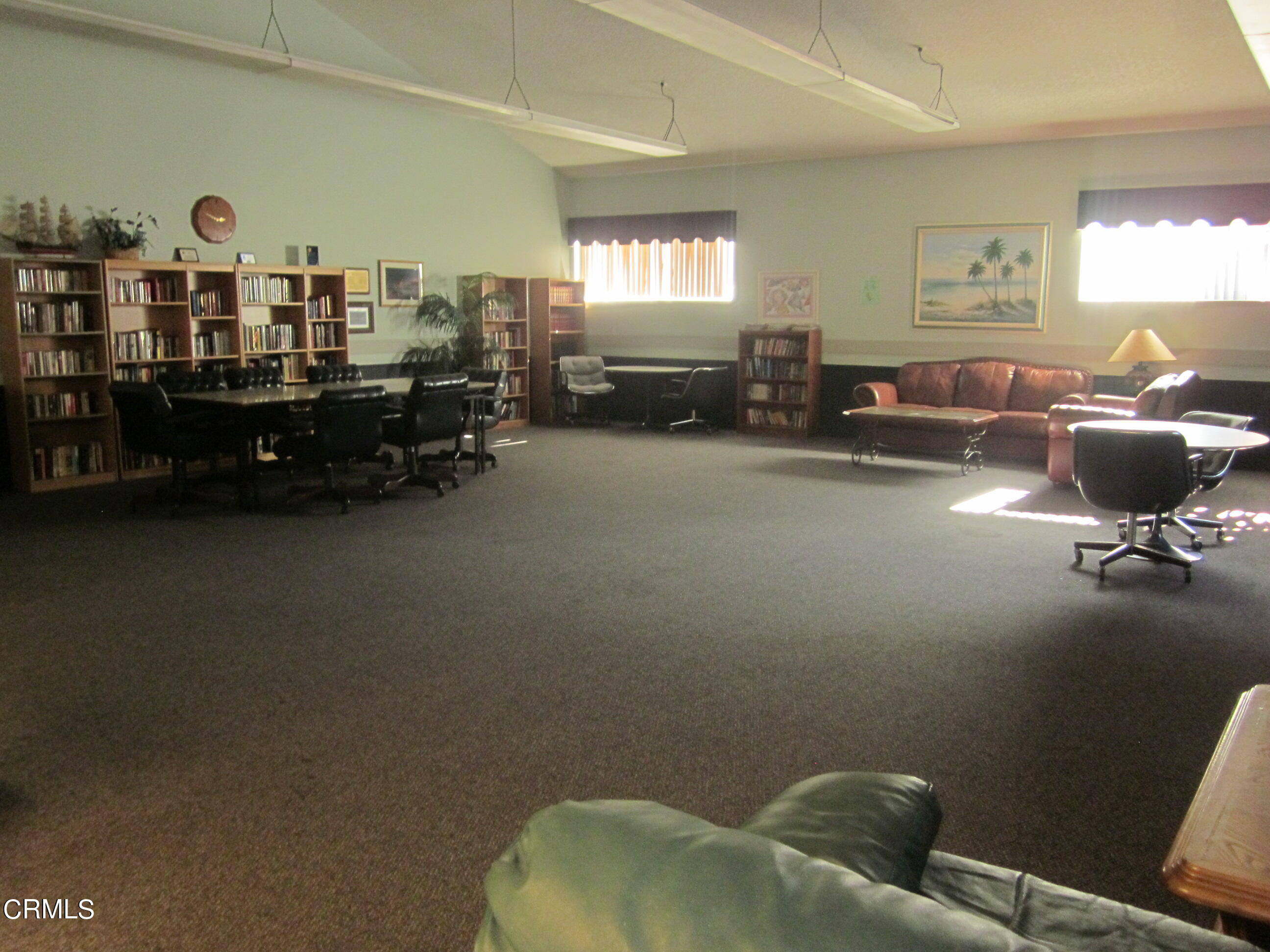 701 Reef Circle Port Hueneme, CA 93041 - Photo 14 of 17 a living room with furniture gym equipment and a window