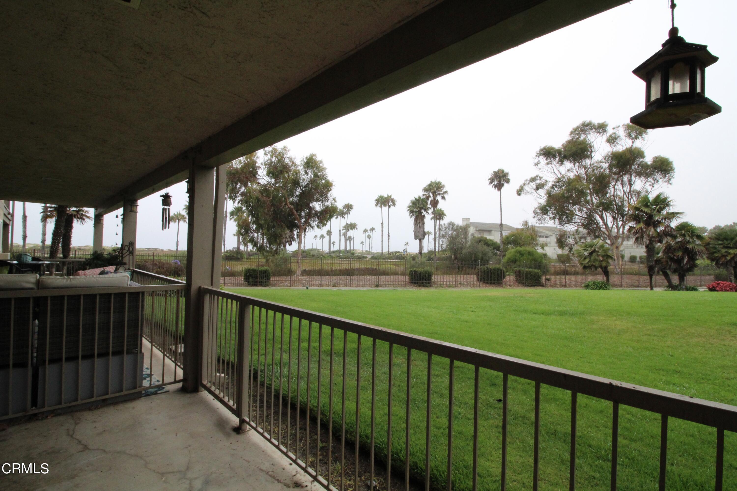 701 Reef Circle Port Hueneme, CA 93041 - Photo 17 of 17 a view of a balcony with a yard