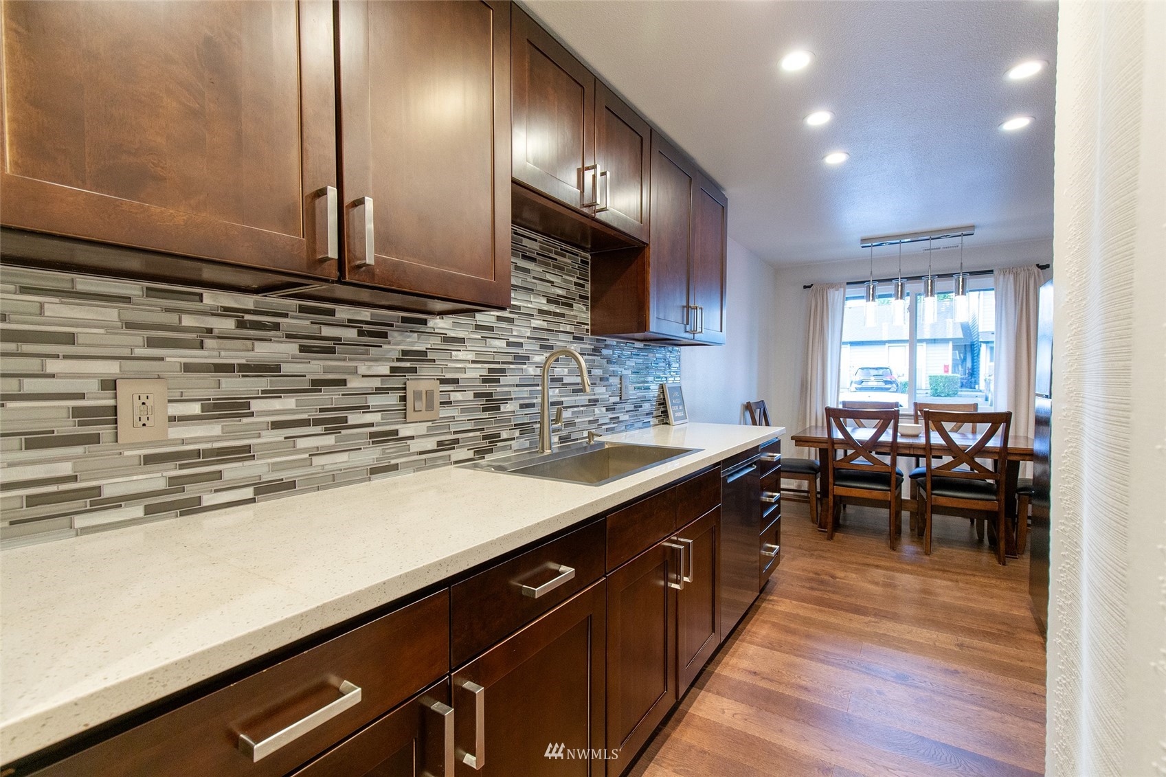 21523 4th Avenue West, Unit B34 Bothell, WA 98021 - Photo 2 of 13 a kitchen with lots of counter top space and living room