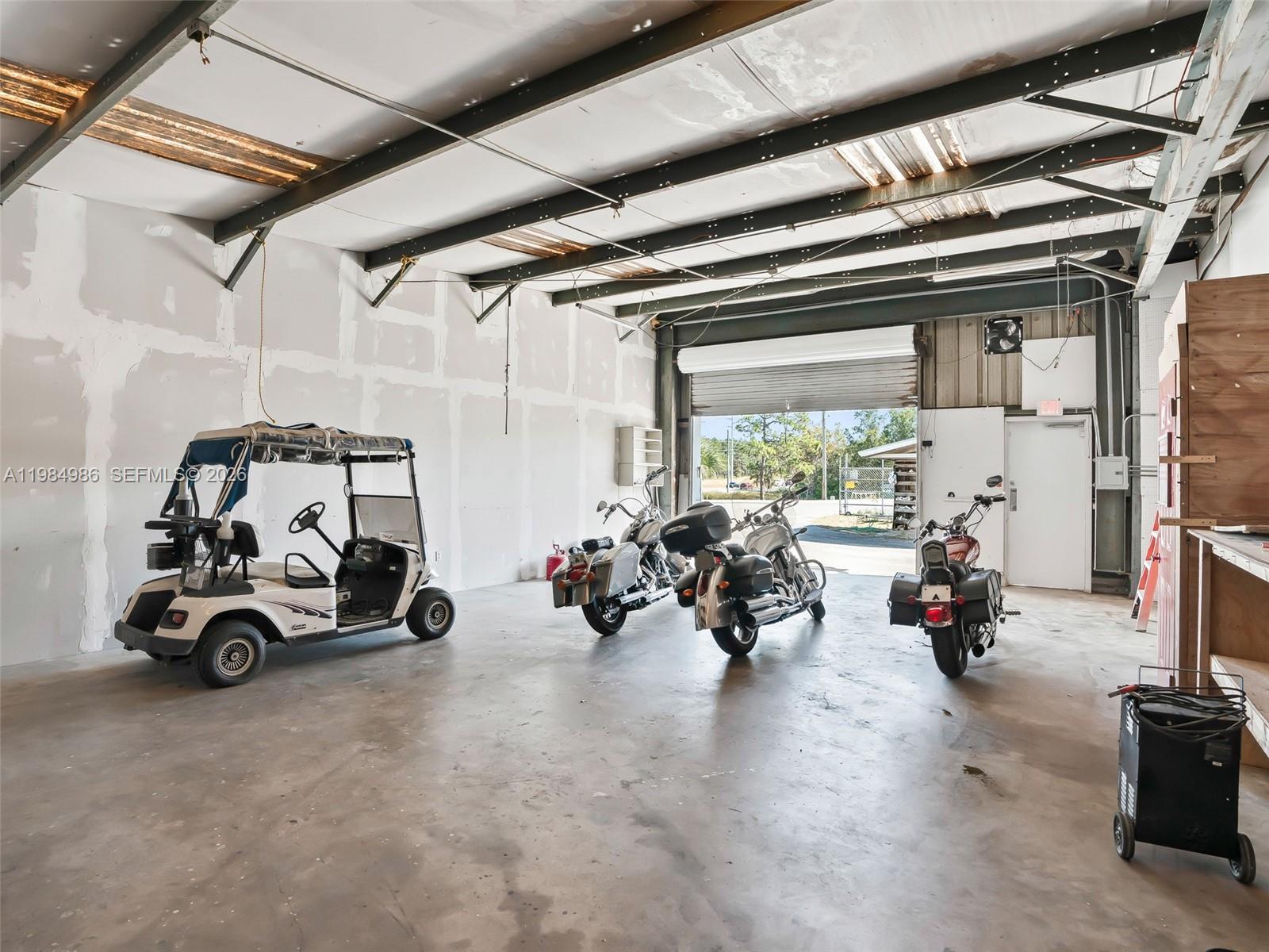 9594 Southeast Maricamp Road Ocala, FL 34472 - Photo 23 of 45 a car parked in garage