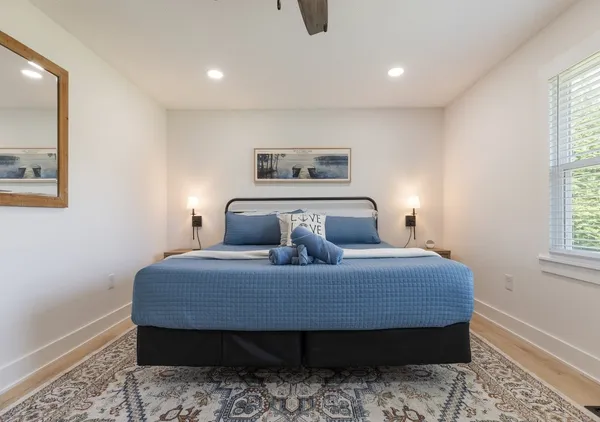 a bedroom with bed and window