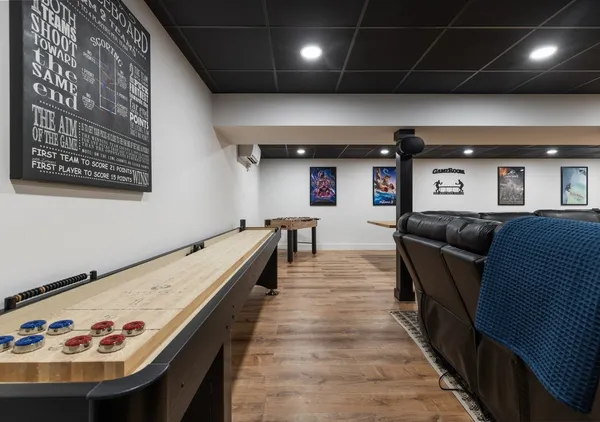 a room with table tennis and stairs