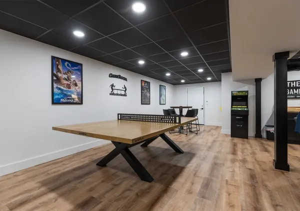 a room with lots of furniture and a flat screen tv