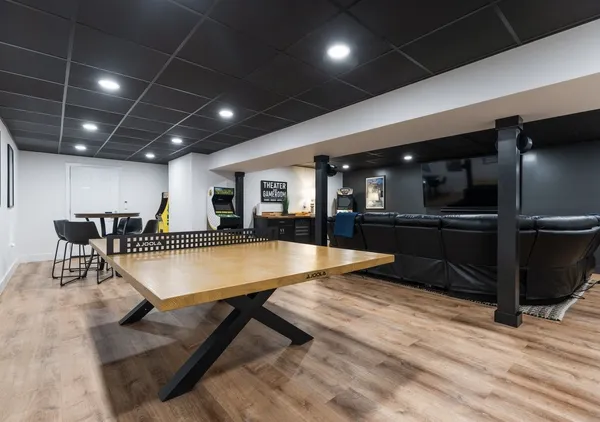 a kitchen with stainless steel appliances kitchen island granite countertop a refrigerator and a stove