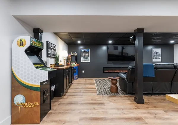 a room with furniture and pool table