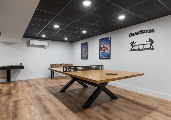 a view of balcony with two chairs and wooden fence