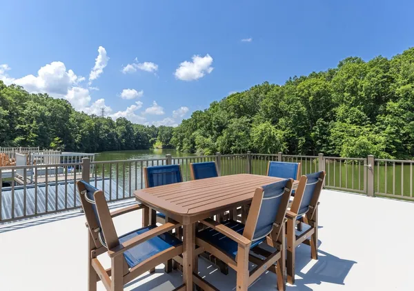 a small swimming pool with some trees in the background