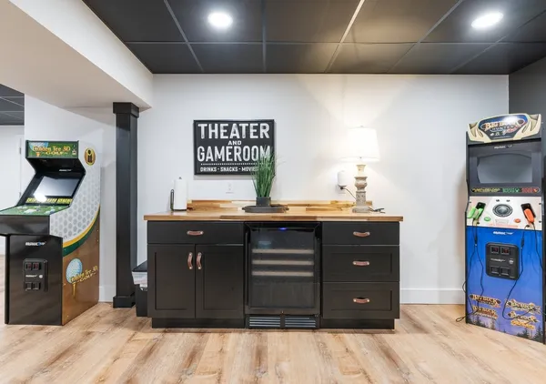 a kitchen with a wooden floor and a sink