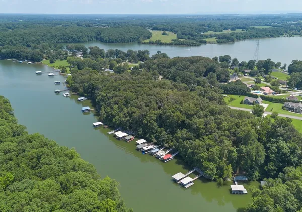 a view of a house with backyard porch and sitting area