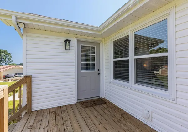 an aerial view of lake residential houses with outdoor space and trees