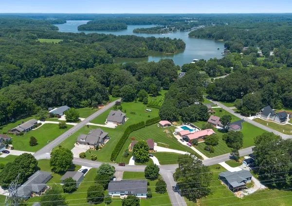 a view of backyard with a table and chairs
