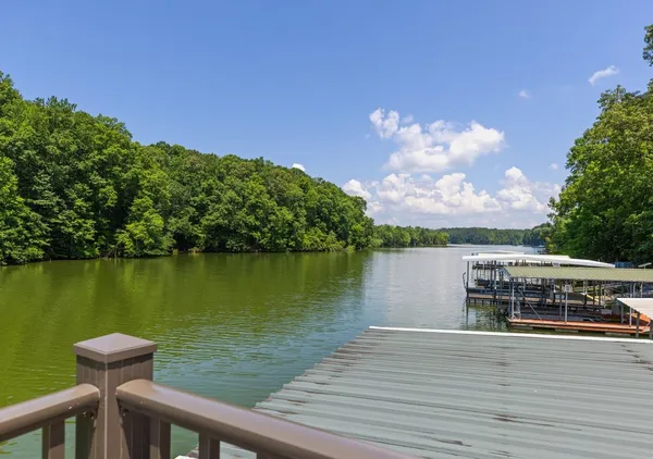 a view of a lake with houses in the background