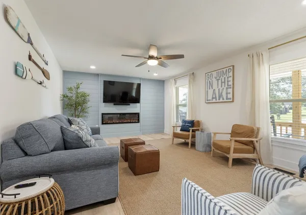 a living room with furniture and a flat screen tv