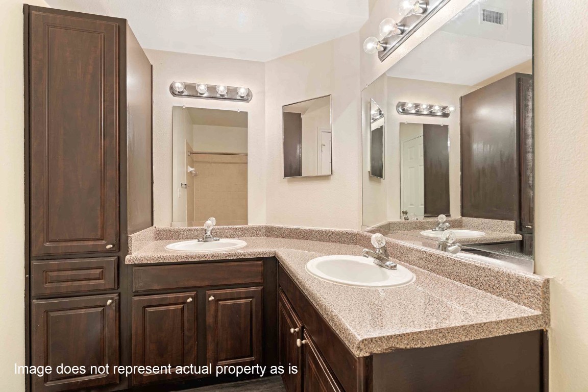 2400-1133 Spring Rain Drive Spring, TX 77379 - Photo 7 of 29 a bathroom with a sink double vanity granite and a mirror