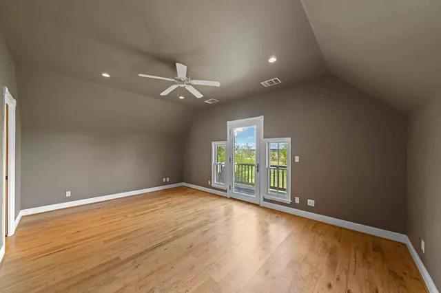 an aerial view of a house with pool and deck