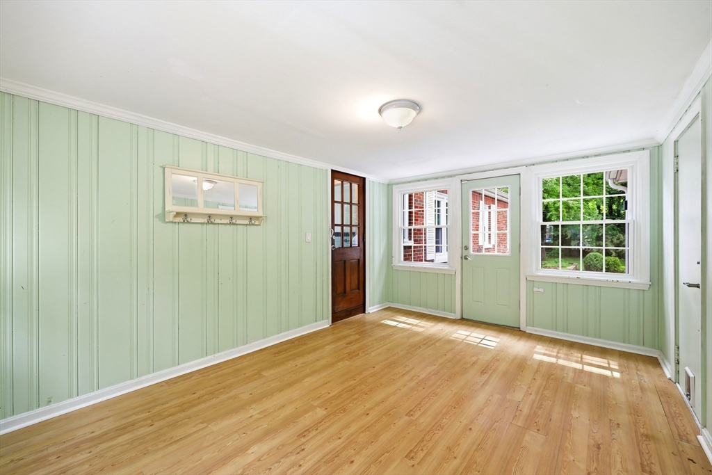 130 Connecticut Avenue Springfield, MA 01107 - Photo 15 of 40 a view of an empty room with a window and wooden floor