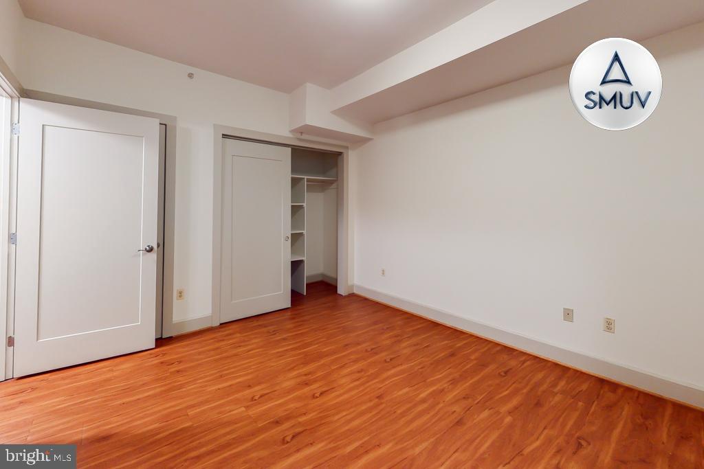 11 East Chase Street, Unit T03 Baltimore, MD 21202 - Photo 17 of 22 an empty room with a window