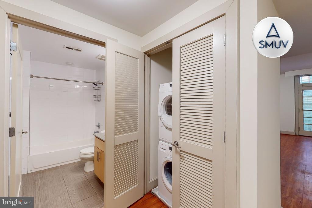 11 East Chase Street, Unit T03 Baltimore, MD 21202 - Photo 8 of 22 a bathroom with a shower and a toilet