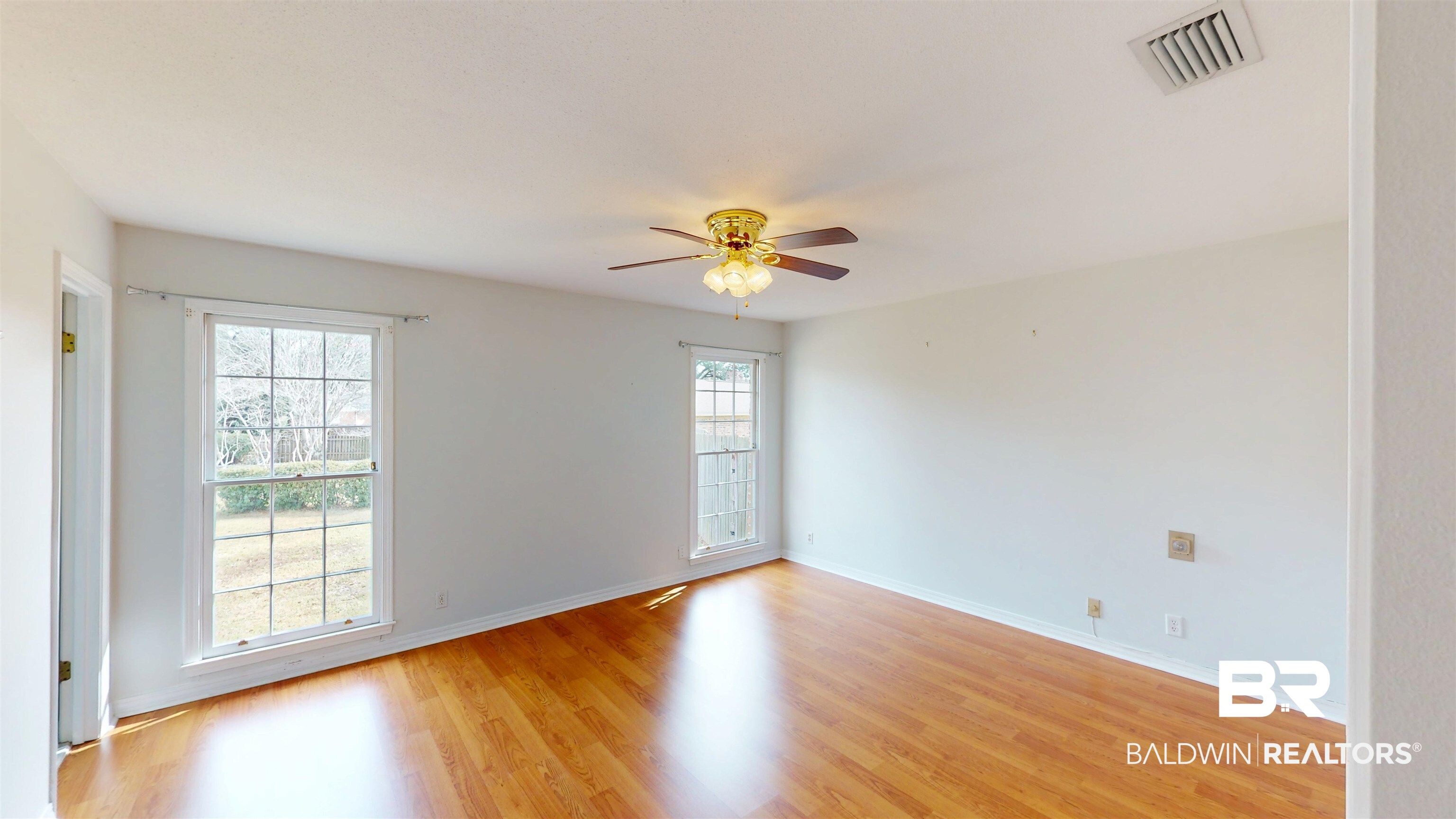 609 Burlington Court Mobile, AL 36608 - Photo 11 of 19 Empty room featuring light wood finished floors and a ceiling fan