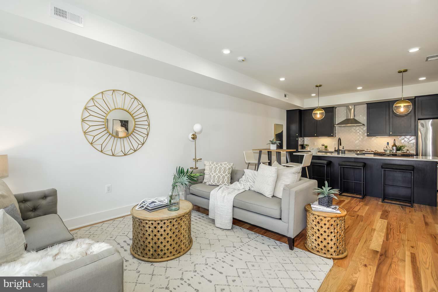 426 Manor Place Northwest, Unit 2 Washington, DC 20010 - Photo 2 of 25 a living room with furniture and a large window