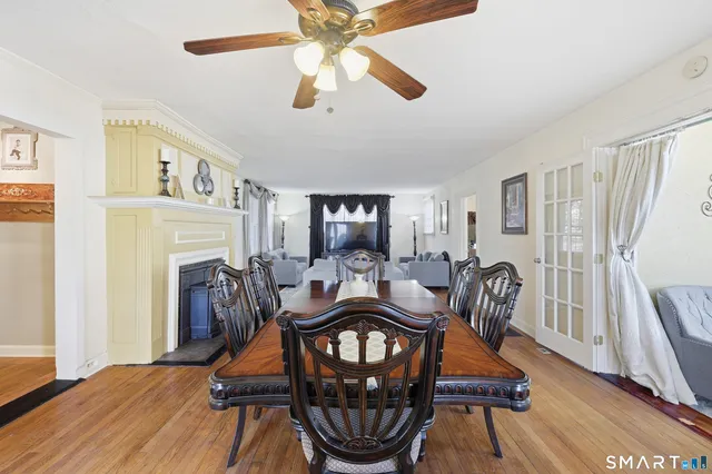 a view of a dining room with furniture window and wooden floor