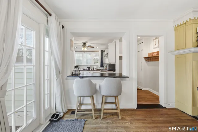 a dining room with furniture and window
