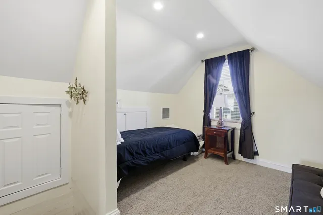 a living room with furniture and a closet