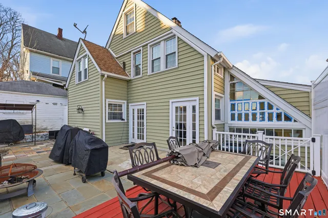 a view of a patio with a table and chairs