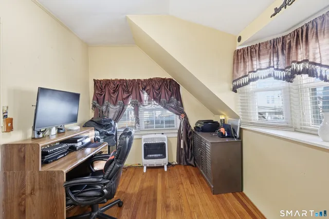 a view of a livingroom with furniture and a fireplace