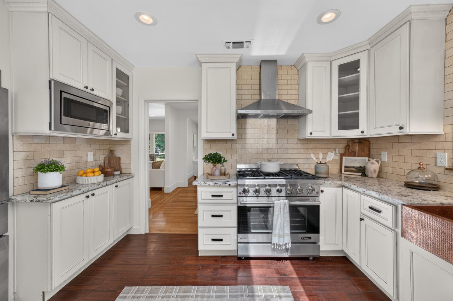 4335 Walnut Avenue Sacramento, CA 95821 - Photo 26 of 62 Premium gas range with stainless steel hood.