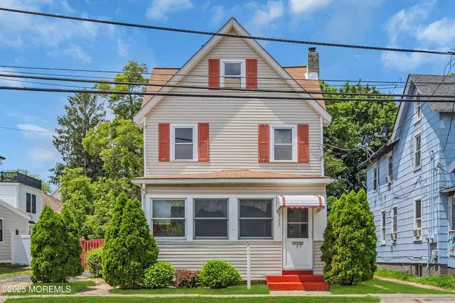 a view of a house with a street