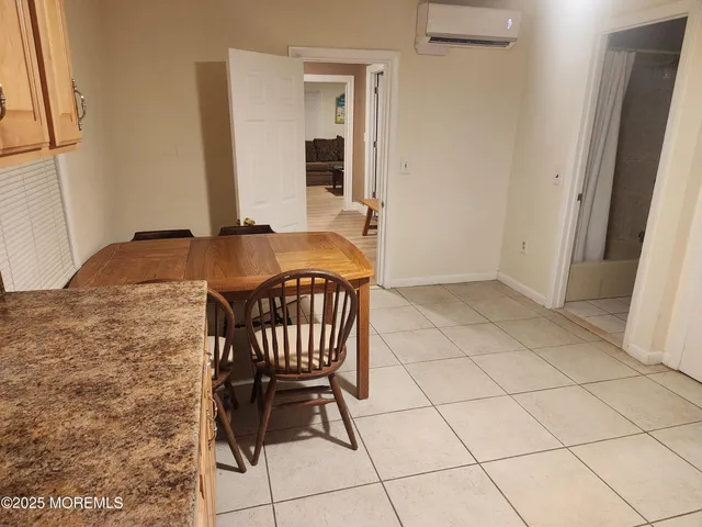 a view of a bathroom with a sink and mirror