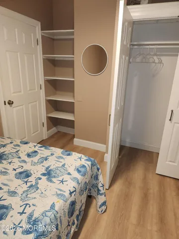 a bedroom with a bed and cabinets