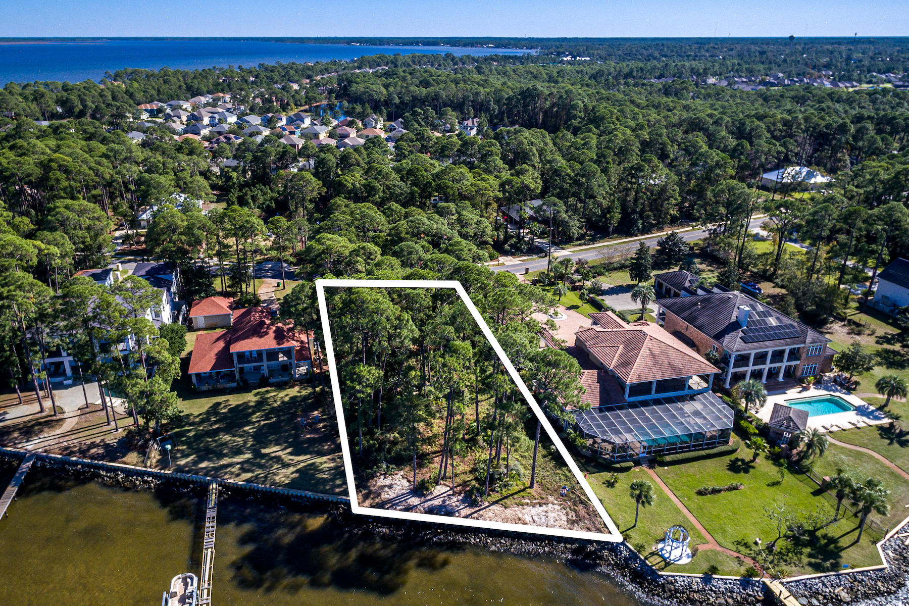 703 Driftwood Point Road Santa Rosa Beach, FL 32459 - Photo 6 of 11 an aerial view of a house with a garden and lake view