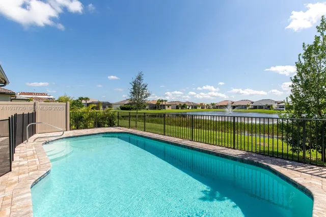 a view of a swimming pool with a terrace