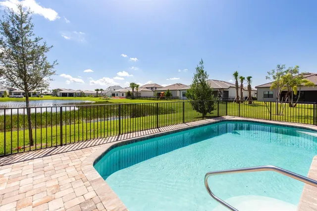 an aerial view of a house with a swimming pool