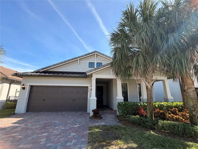 a front view of house with yard and outdoor seating