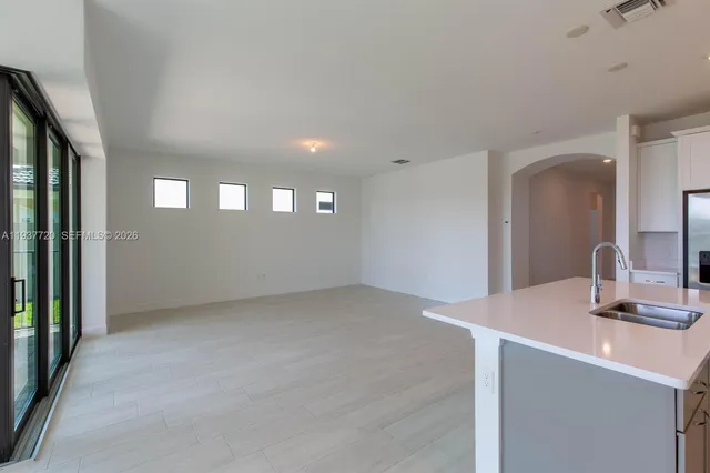 a view of an empty room and a window