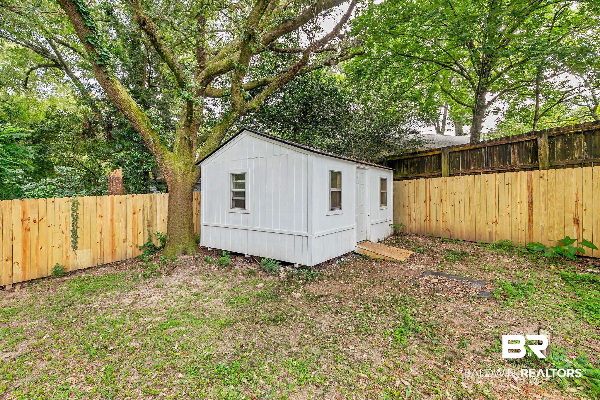 4705 Sherry Court Mobile, AL 36693 - Photo 75 of 100 View of outbuilding with a fenced backyard
