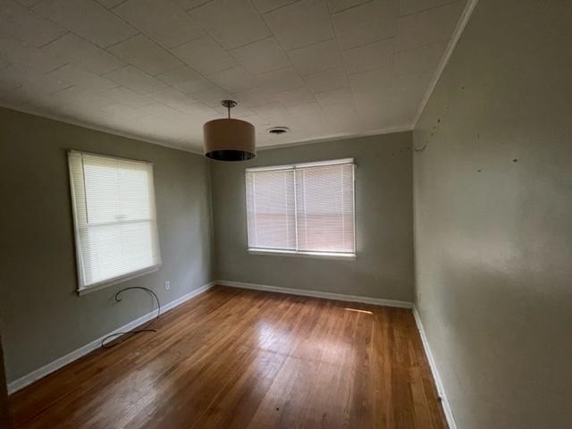 3300 Lucibill Road Memphis, TN 38116 - Photo 7 of 14 a view of an empty room with wooden floor and a window