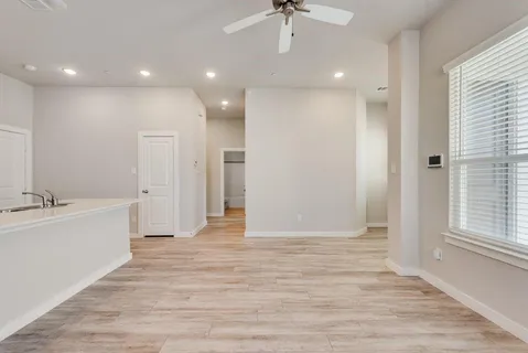 a view of an empty room and a window