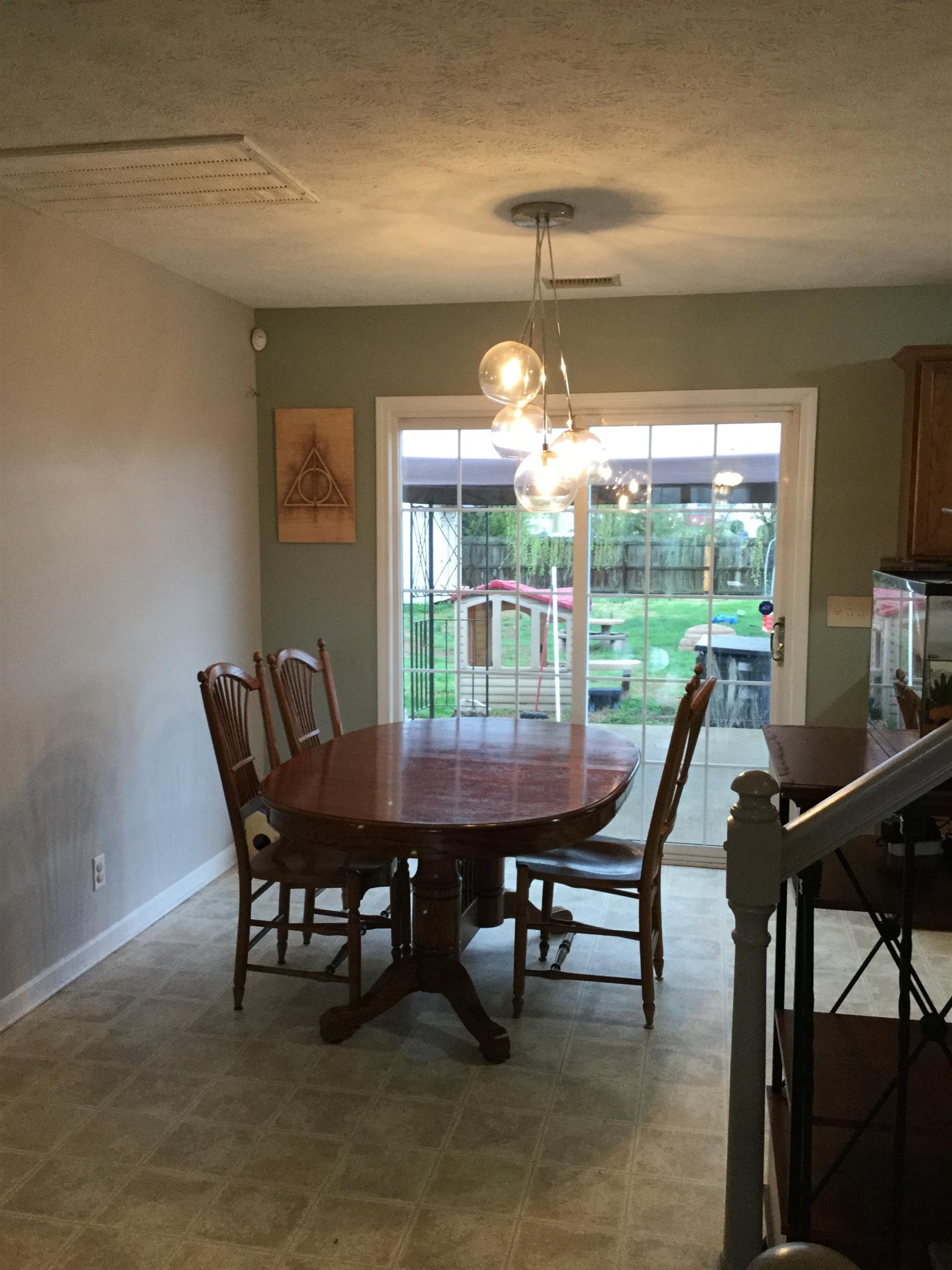 669 Crescent Road Murfreesboro, TN 37128 - Photo 13 of 16 a view of a dining room with furniture wooden floor and chandelier