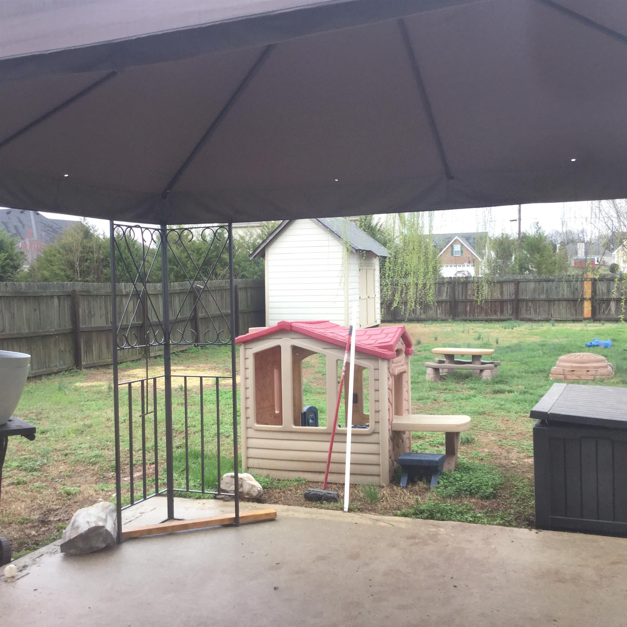 669 Crescent Road Murfreesboro, TN 37128 - Photo 14 of 16 a backyard of a house with table and chairs