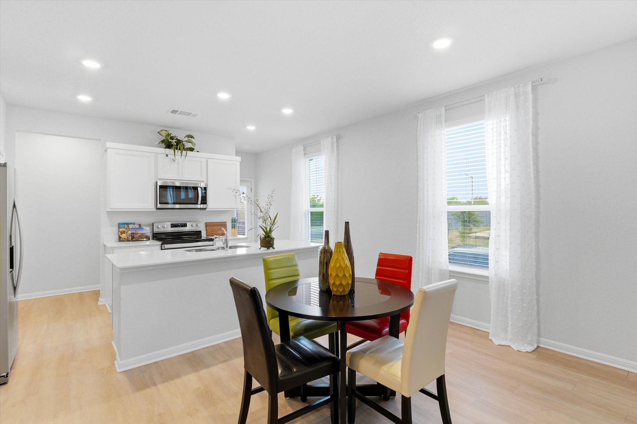 149 Cutleaf San Marcos, TX 78666 - Photo 7 of 25 Dining area with room to have counter stools at the kitchen island