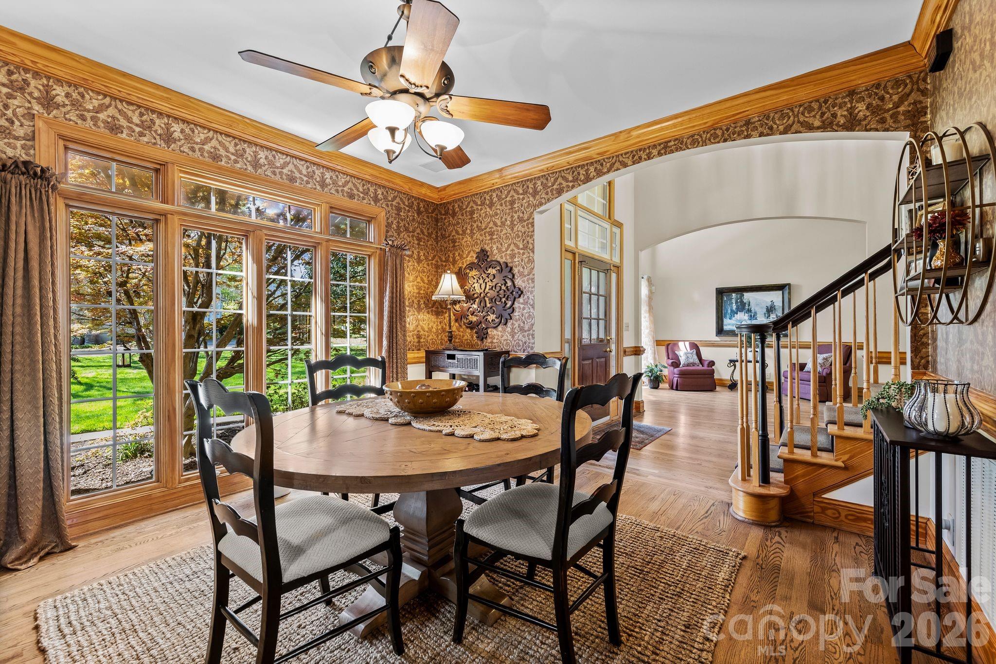 3530 Cardiff Lane Matthews, NC 28104 - Photo 8 of 39 a view of a dining room with furniture window and wooden floor