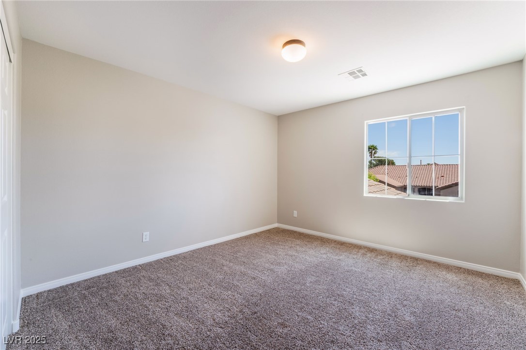 7857 Midnight Ride Street Las Vegas, NV 89131 - Photo 24 of 53 Carpeted empty room with baseboards