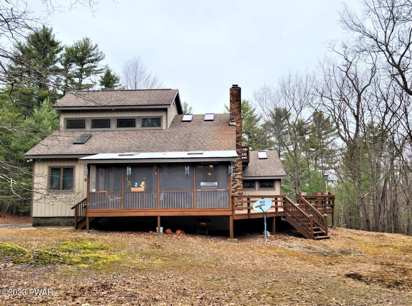 114 Rim Rock Road Milford, PA 18337 - Photo 1 of 25 a front view of a house with a yard