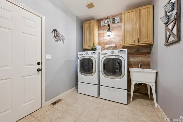 a utility room with dryer and washer
