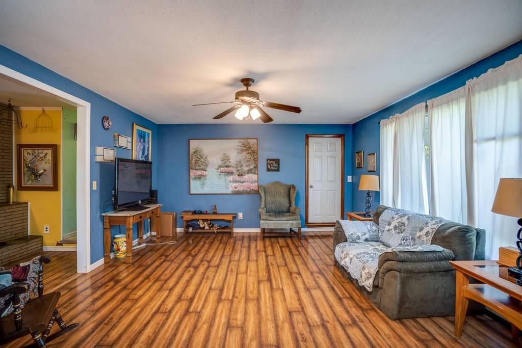 21 Tanner Road Webster, MA 01570 - Photo 11 of 26 a living room with furniture and a flat screen tv